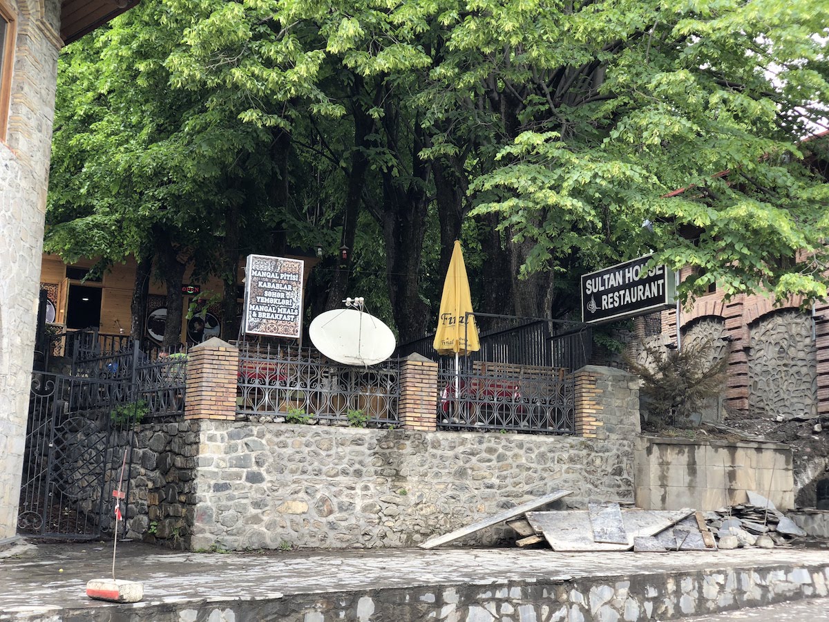 Picture of a restaurant behind trees